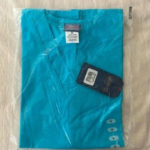Light blue Cherokee scrub top. XS. Never worn with tags
